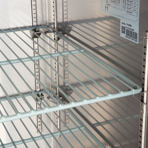 A close up of a metal Avantco wire shelf with a label on it.