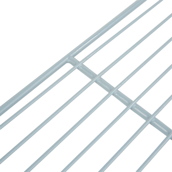 A close-up of a white metal wire shelf.