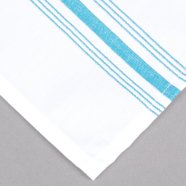 A white cloth napkin with blue and white stripes.