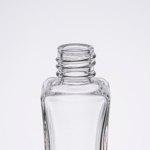 A close-up of a clear glass Tablecraft Metro salt and pepper shaker.