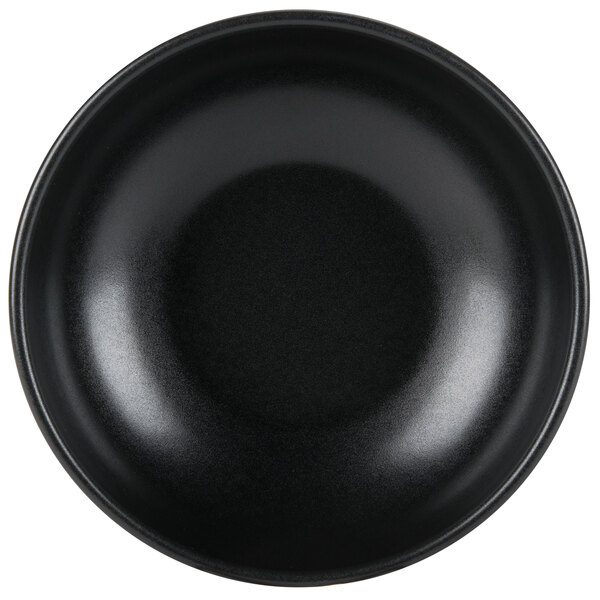 A black Hall China bistro bowl with a white background.