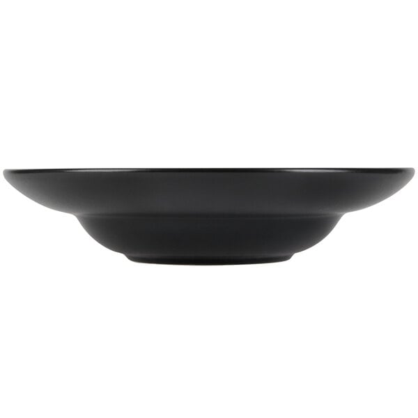 A black Hall China bowl with a white background.