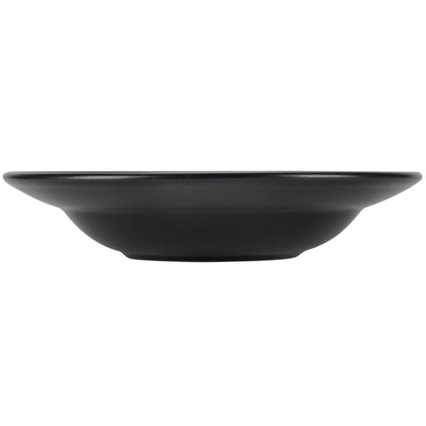 A black bowl with a white rim on a white background.