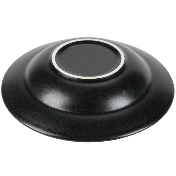 A black bowl with a white rim.
