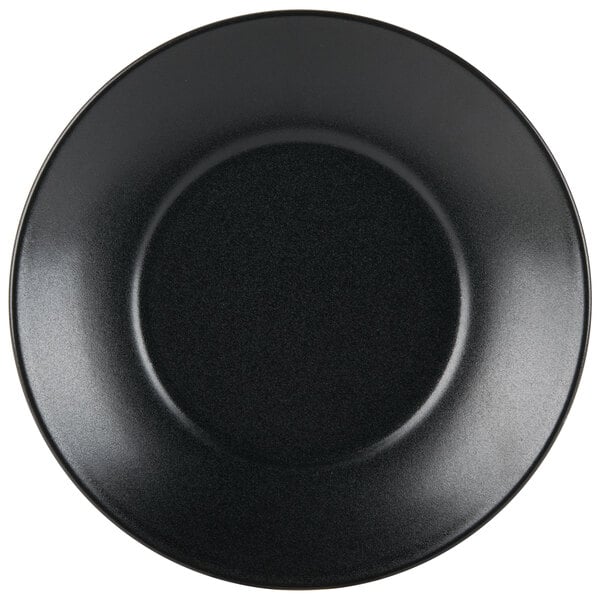 A close up of a black Hall China bowl with a white background.