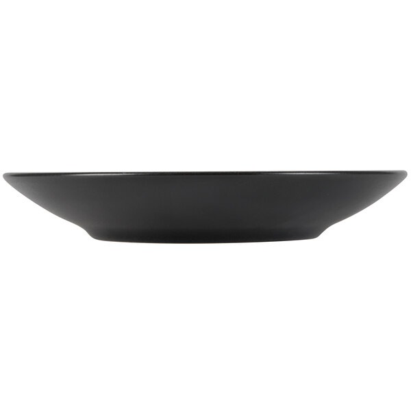 A black Hall China bowl on a table.