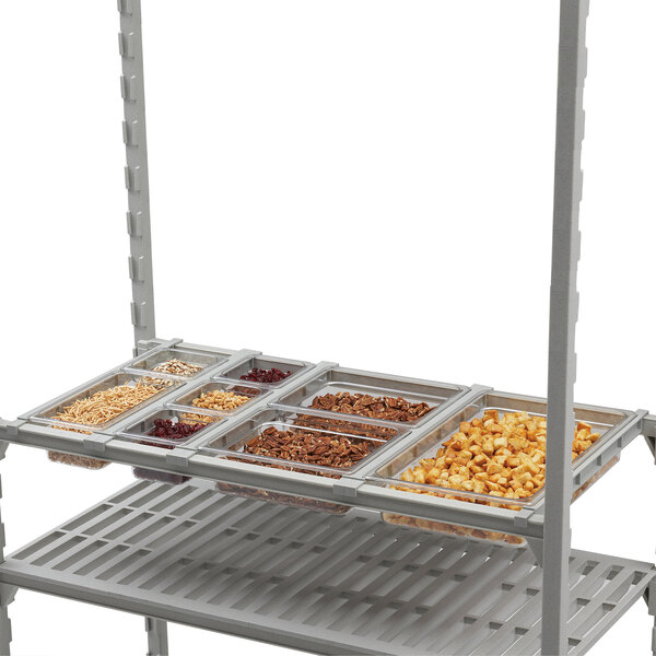 A Cambro Camshelving® divider bar on a shelf with different types of cereals.