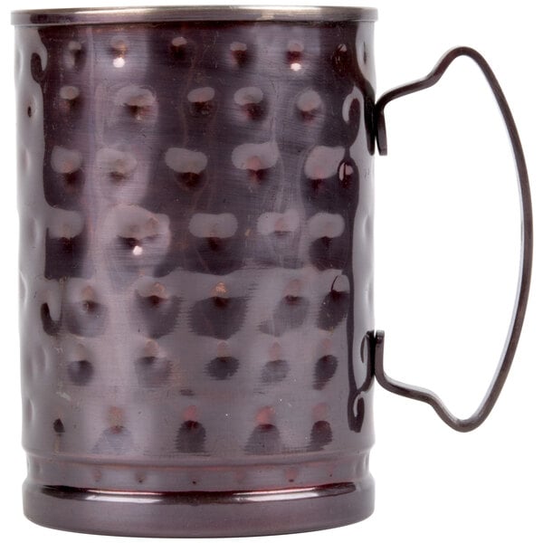 A Libbey hammered antique copper Moscow Mule mug with a handle.