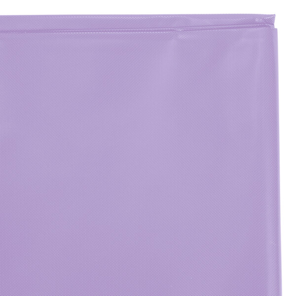 A close up of a Creative Converting Luscious Lavender purple plastic table cover in a bag with a zipper.