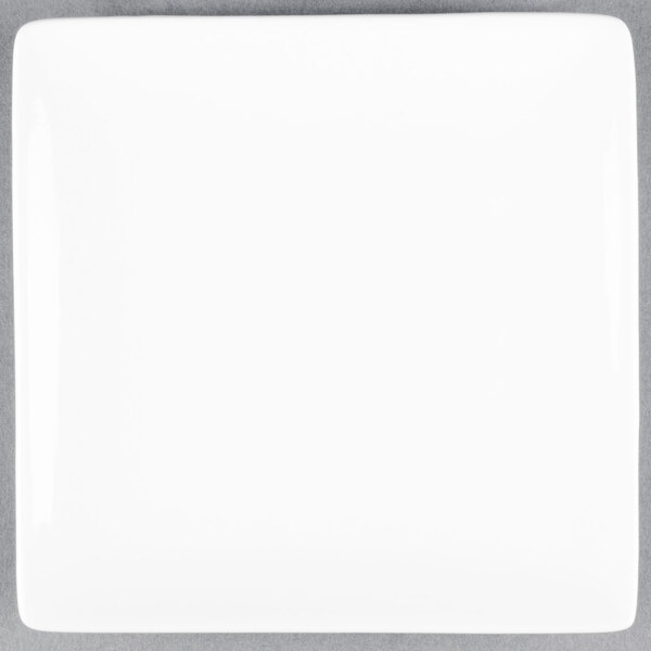 A Libbey Ultra Bright White square porcelain plate with a white background.
