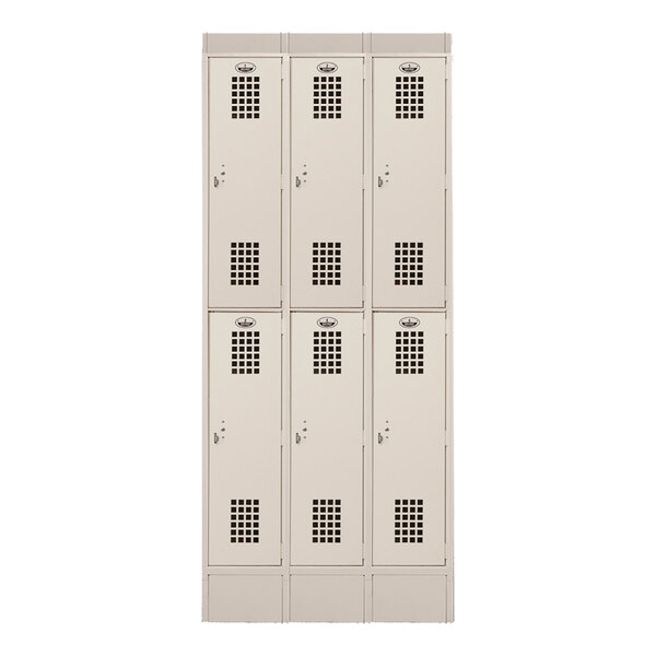 A beige metal locker unit with three columns and six doors, each door featuring two square vent panels.