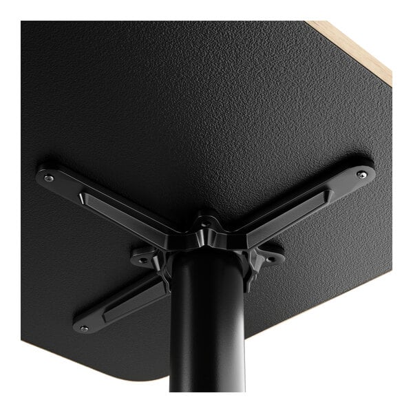 A FLAT Tech black table leg with a black square base.