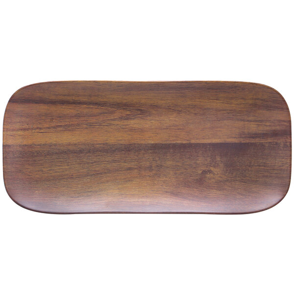 A rectangular wooden Carlisle melamine tray with a woodgrain finish.