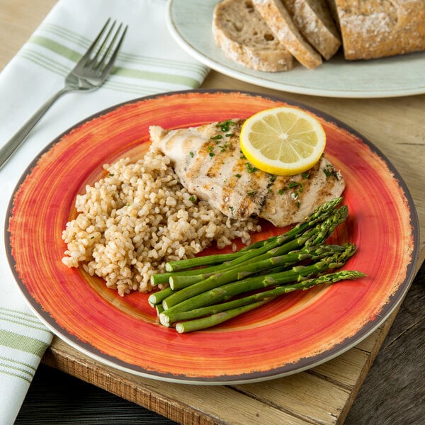 A Carlisle Mingle melamine plate with rice, asparagus, and chicken on it.