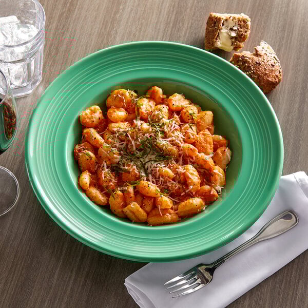 a plate of food with cheese and herbs