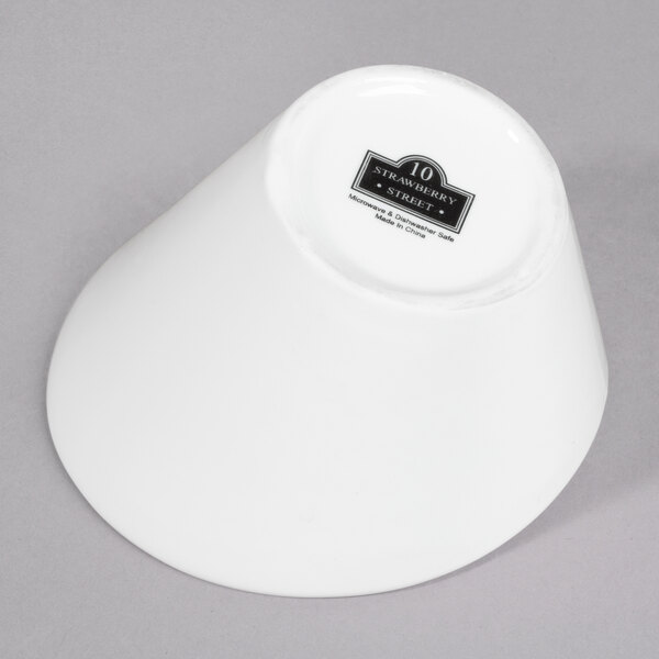 A white 10 Strawberry Street porcelain tall slant bowl.