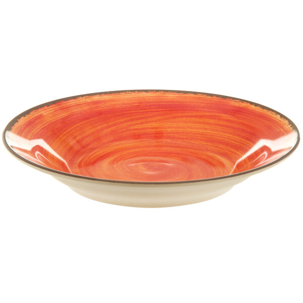 A Carlisle white melamine bowl with a red rim.