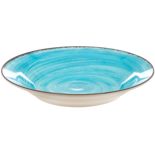 A blue bowl with a white rim.