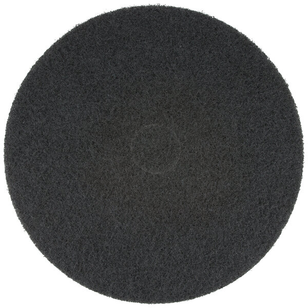 A 3M black floor stripping pad with a black center circle.