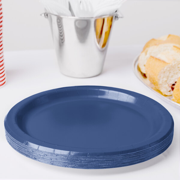 A stack of navy blue paper plates.