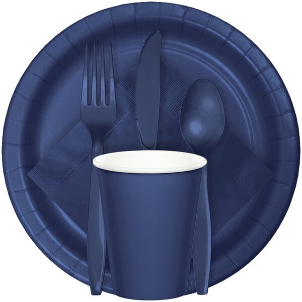 A navy blue paper plate with a fork, spoon, and a blue cup.