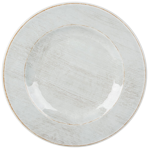 A white plate with a light blue rim.