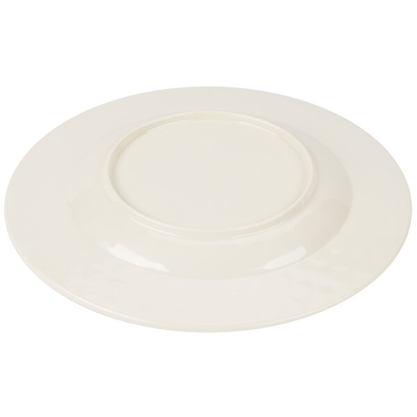 A white Carlisle melamine plate with a round rim.