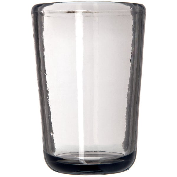 A clear Carlisle Tritan plastic juice glass with a smoke bottom and black rim.
