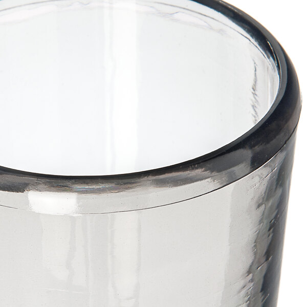 A Carlisle Tritan plastic juice glass with a smoke color.