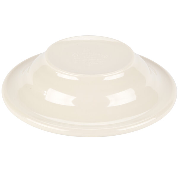 A white bowl with a few white spots on the inside.