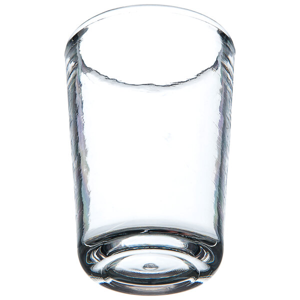 A Carlisle Mingle Tritan plastic juice glass filled with a small amount of clear liquid.