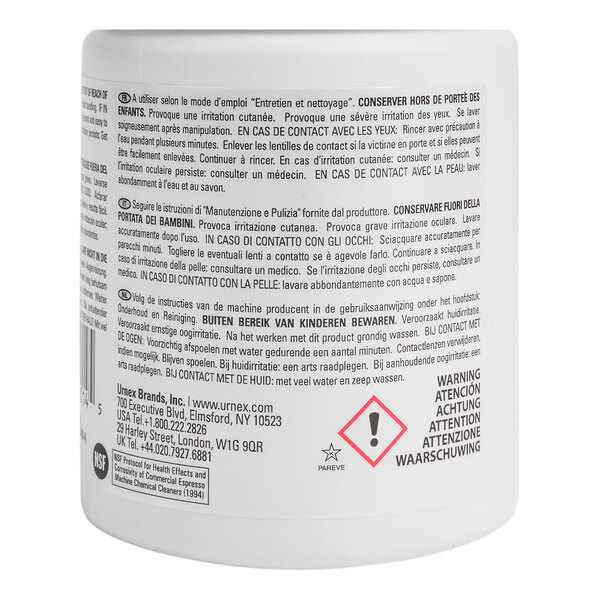 A container of Urnex Cafiza espresso machine cleaning tablets with multilingual safety and usage instructions on the label.