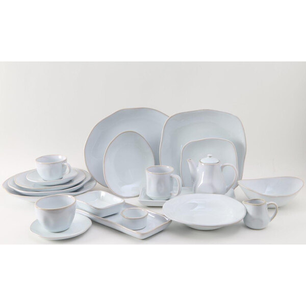 A group of Tuxton Artisan Agave white square plates.