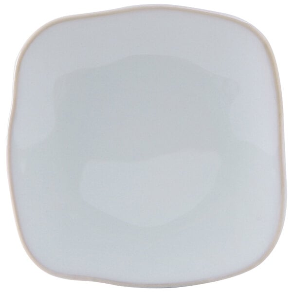 A white square Tuxton Artisan china plate with a small square design on the edge.