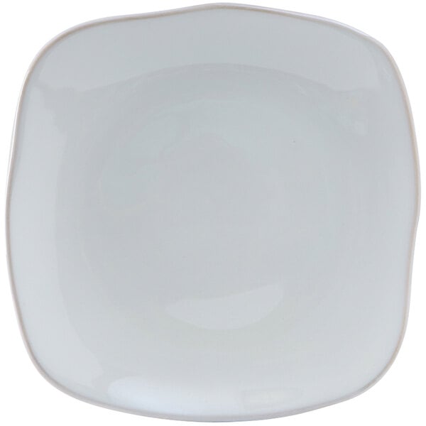 A white square Tuxton Artisan china plate with a small curved edge.