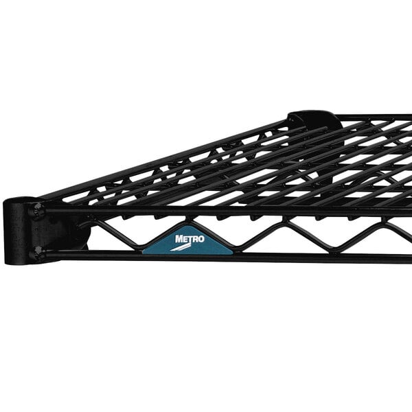 A black metal Metro Super Erecta wire shelf with blue text.