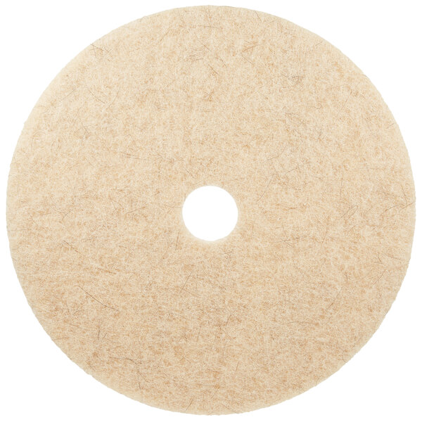A white circular 3M Natural Blend tan burnishing floor pad with a hole in the center.