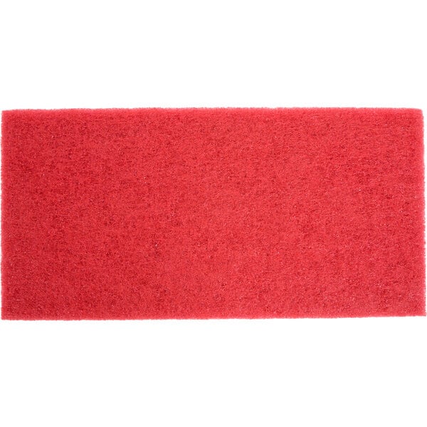 A red rectangular 3M buffing pad with small specks on it.