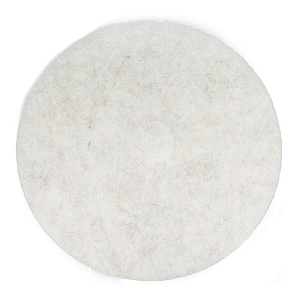 A round, white floor polishing pad.