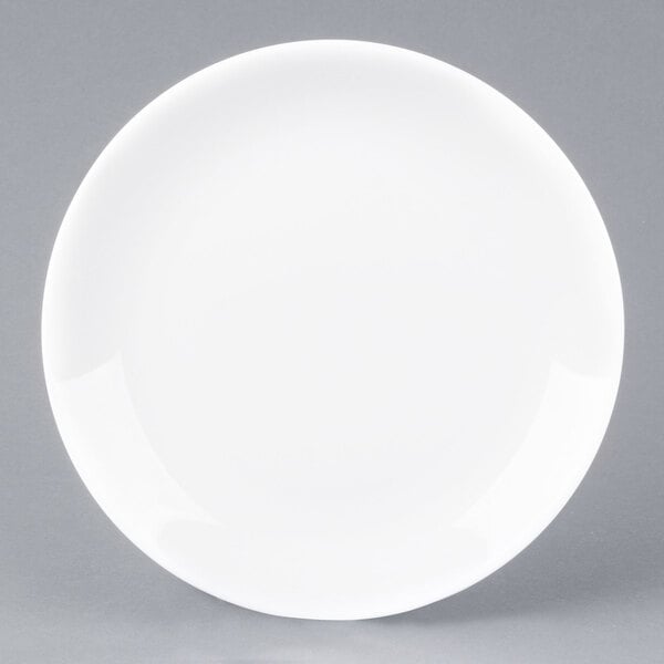 An Arcoroc white porcelain brunch plate with a small rim.