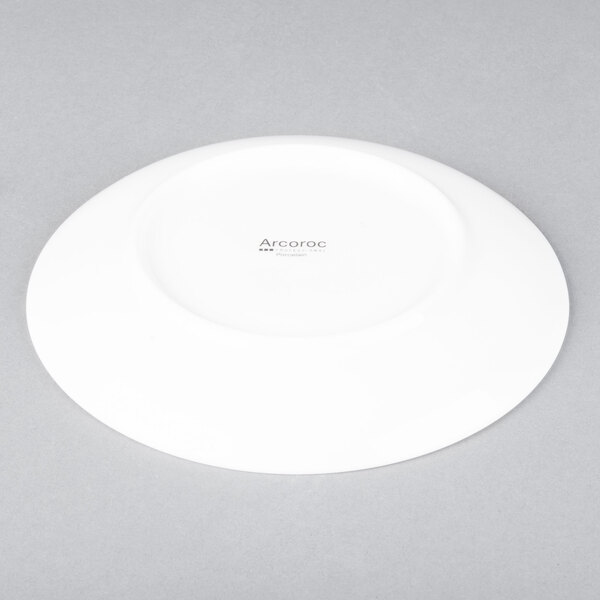 An Arcoroc white porcelain B and B plate with a white rim.