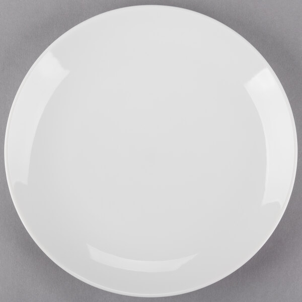 A white Arcoroc porcelain salad plate with a white rim.
