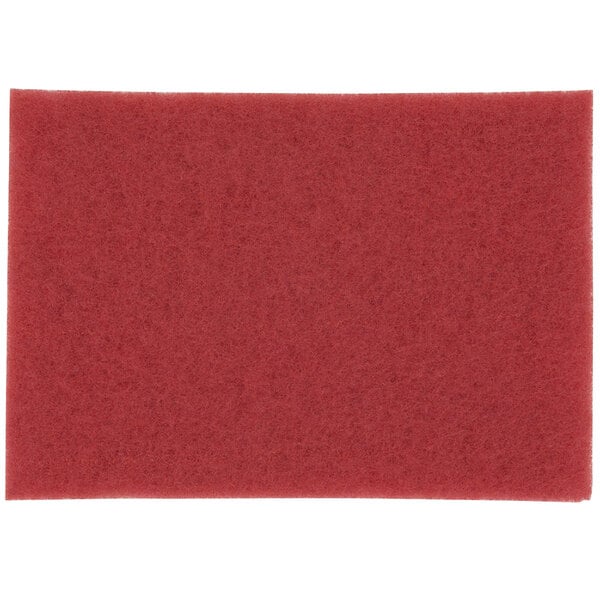 A red rectangular 3M buffing pad.