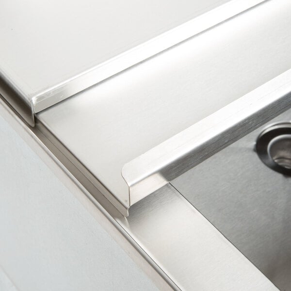 A stainless steel Eagle Group underbar ice chest on a counter.