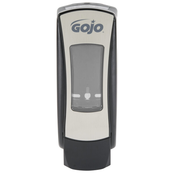 A chrome GOJO soap dispenser.