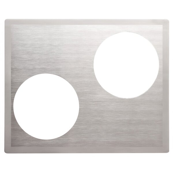 A metal plate with two white circular insets.