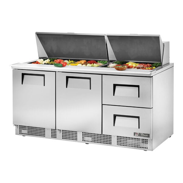 A True stainless steel sandwich prep table with two drawers.