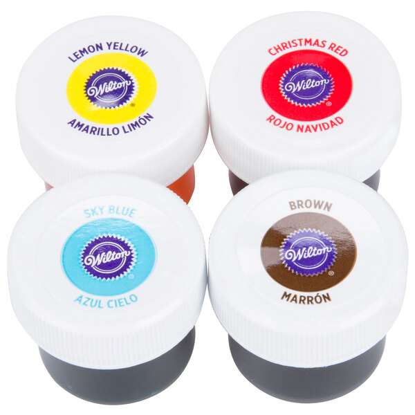 A Wilton 4 pack of primary gel food coloring bottles on a table.