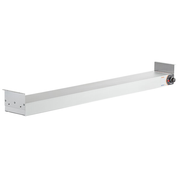 A long rectangular white metal object with a red button.