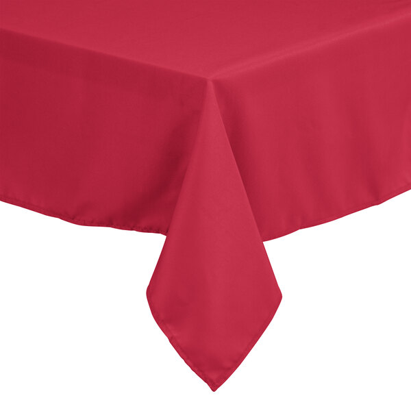 A hot pink rectangular Intedge table cover on a table.